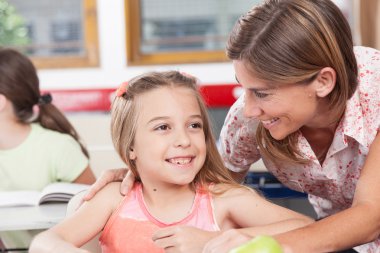 teacher helping a pupil