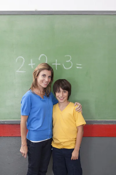 The teacher giving a hug to her pupil