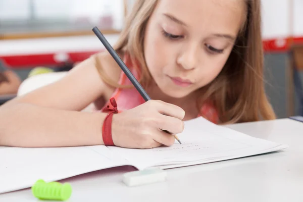 Little girl studying Royalty Free Stock Photos