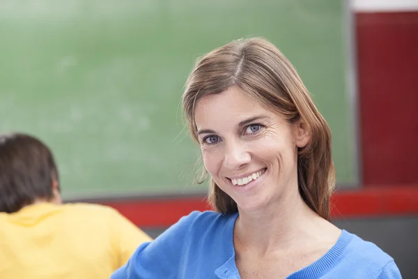 Smiling teacher working Stock Photo