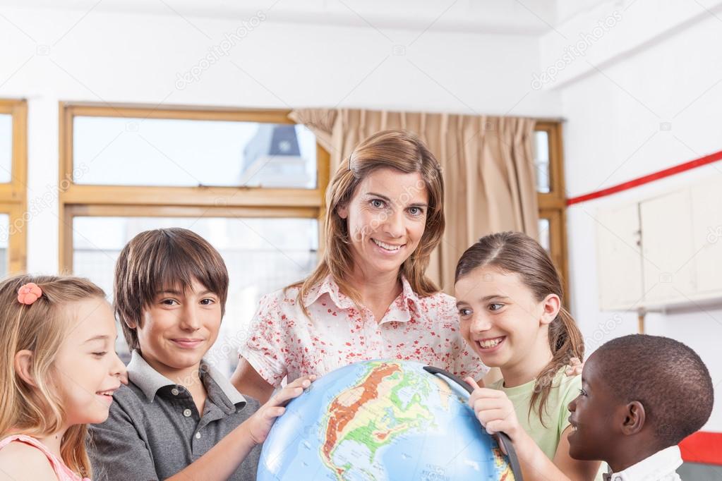 teacher and pupils on geography class
