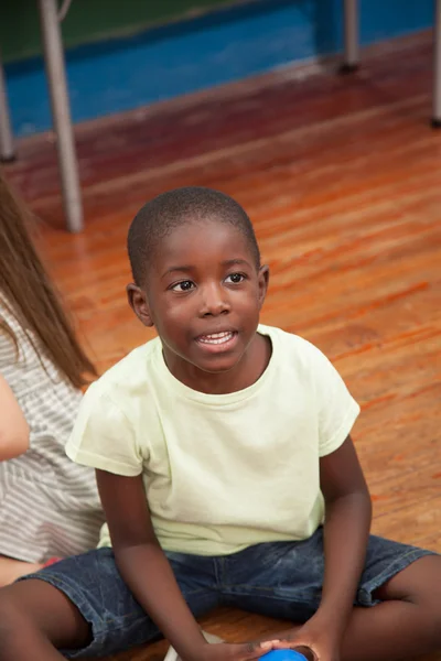 Black boy holding ball — Stock Photo, Image