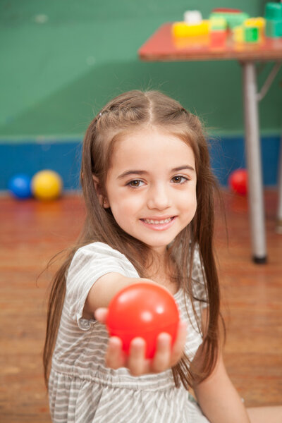 Girl holding a plastic ball