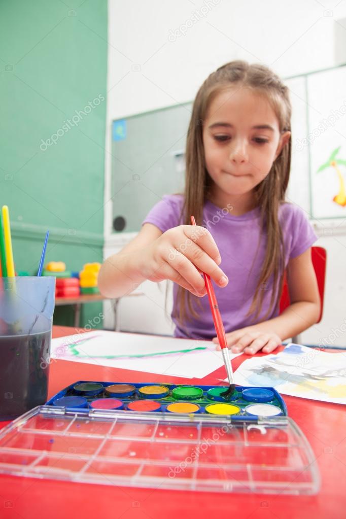 little girl drawing a picture