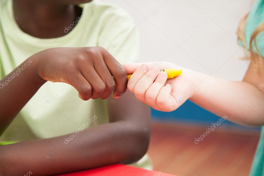 Kids sharing one pencil