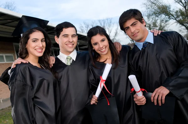 Students holding their diplomas — Stock Photo, Image