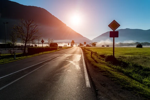 Sunset above the foggy village — Stock Photo, Image