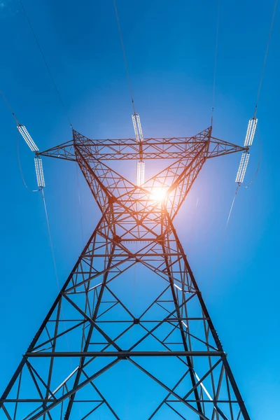 Sunset above the powerline and the blue clear sky — Stock Photo, Image