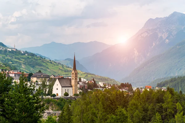 Sunset above small church in mountains Alps — Stock Photo, Image