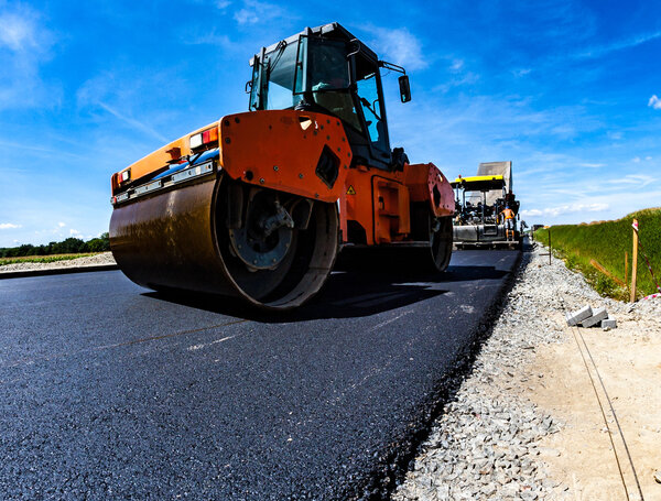 Road roller working on the construction site