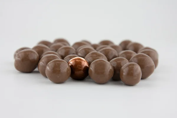 Chocolate drops flat GOLD — Stock Photo, Image