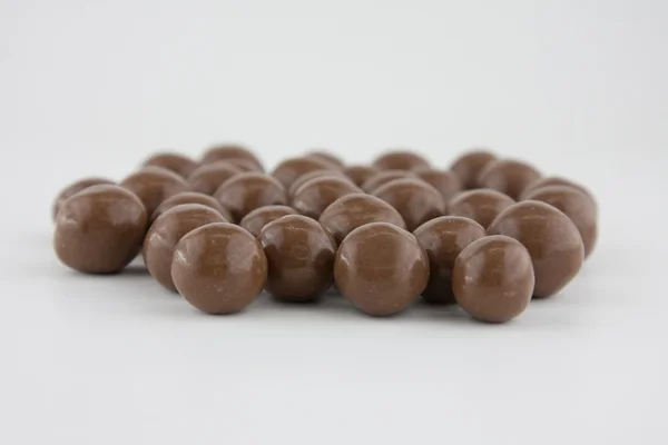 Chocolate drops flat — Stock Photo, Image