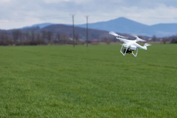 Small drone above the field