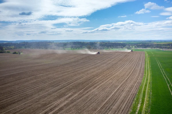 Aerial view of the tractor harrowing the field — Stock Photo, Image