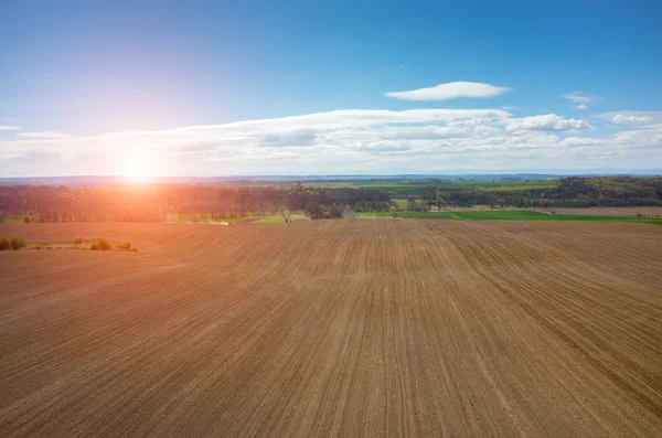 Aerial view of the sunset above the field — Stock Photo, Image