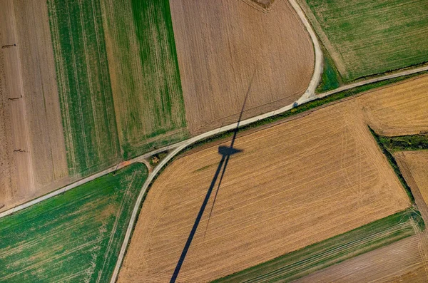 Aerial view on the windmill's shadow — Stock Photo, Image