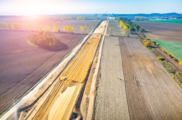 Günbatımı inşaat altında yolu üzerinde — Stok fotoğraf