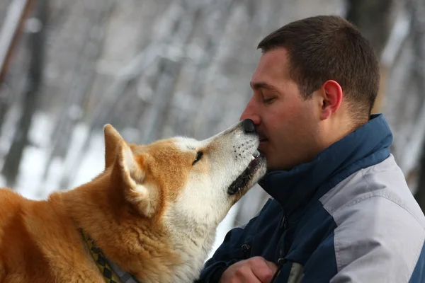 Man with dog and cracker — Stock Photo, Image