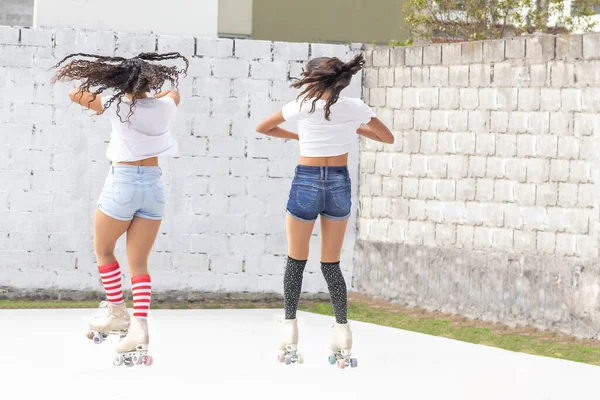 Two Teenage Girls Jumping Spinning Roller Skates Summer Morning — Stock Photo, Image