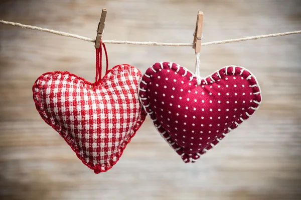 Colorful fabric hearts on wood backgrounds — Stock Photo, Image