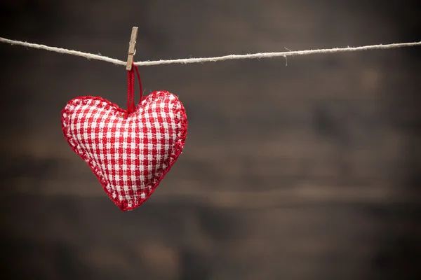 Colorful fabric hearts on wood backgrounds — Stock Photo, Image