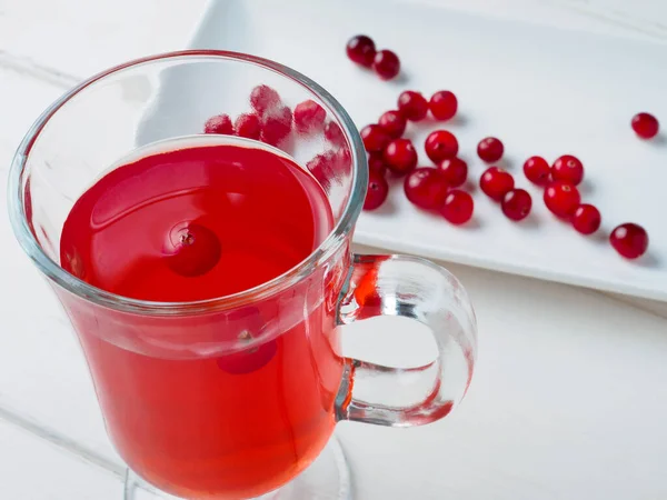 Selective focus on cranberries in a fresh drink in a glass cup — Stock Photo, Image