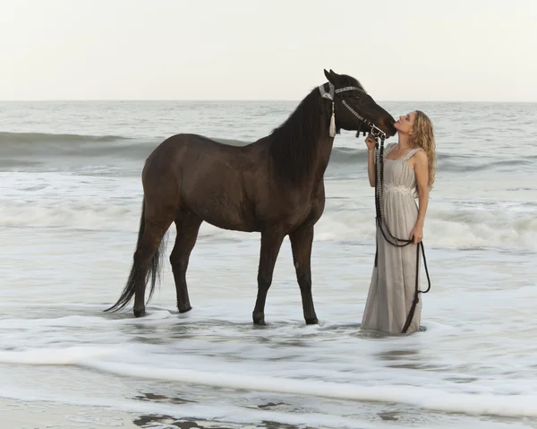 Medieval woman and horse in water — Stock Photo, Image