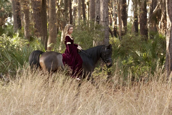 Medieval woman riding horse — Stock Photo, Image