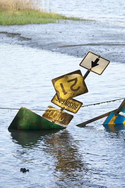 Road signs on flooded road — Stock Photo, Image