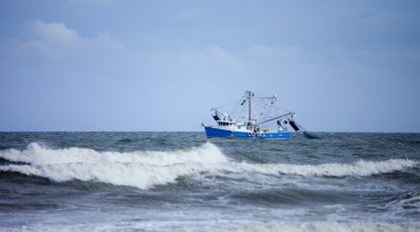 shrimp boat in rough seas clipart