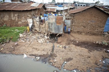 children and filthy water, Kibera Kenya clipart