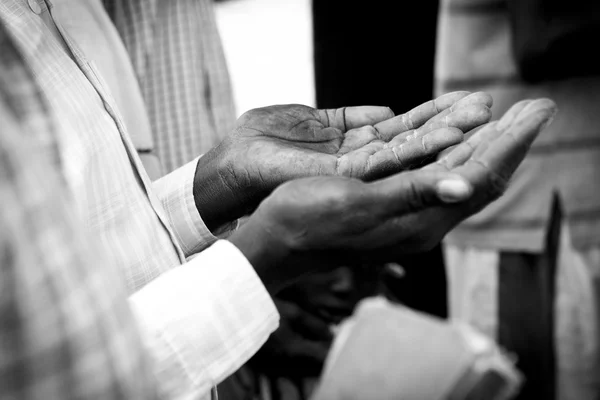 Hands of man praying in South Sudan — Stock Photo, Image