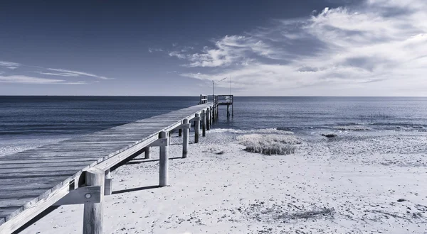 Infrared photo of dock and ocean — Stock Photo, Image