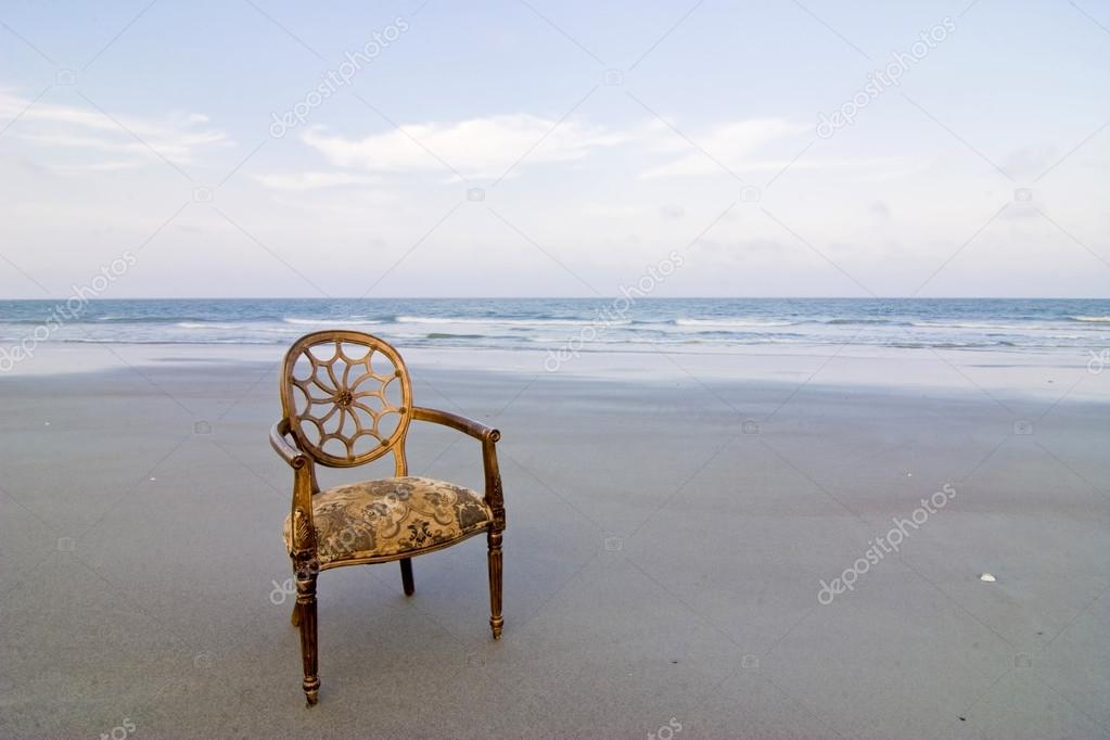 ornate chair on beach