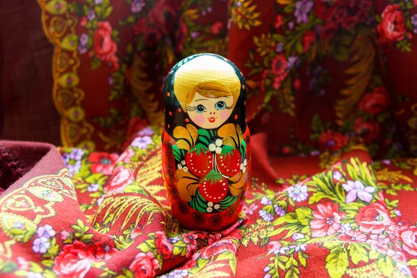 Bright cheerful background Matryoshka on shawl with flowers Stok Fotoğraf