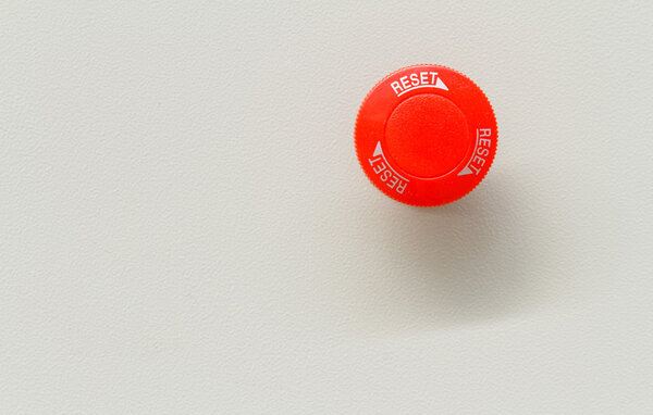 Red emergency stop and reset button.
