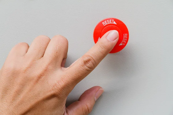 Finger touch on red emergency stop switch and reset — Stock Photo, Image