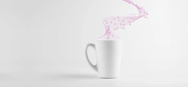 White cup of coffee on a white background. Isolated. Sheet music and music.