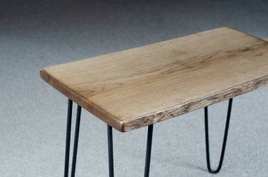 Part of a panel board wooden table. Butt. Loft-style table legs. In the room