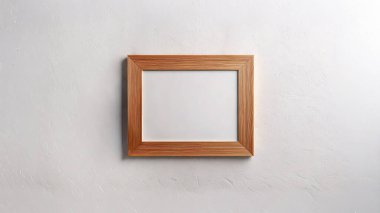 Boş bir duvara asılı boş bir fotoğraf çerçevesi. Boş boşluk