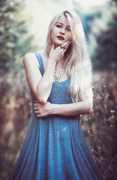 Beautiful young woman in  dress with long snow-white hair on nat — Stock Photo, Image