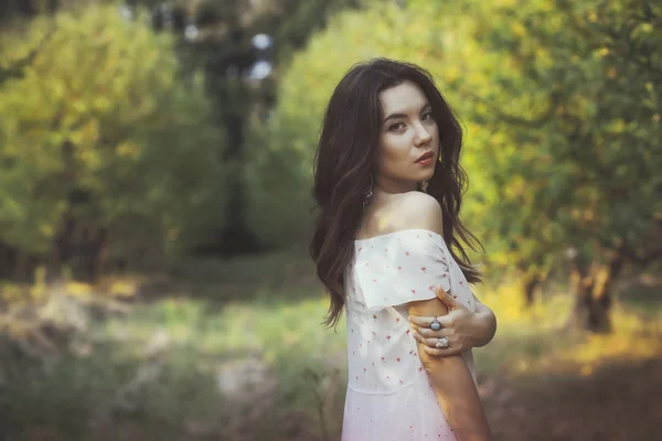 Beautiful young girl in the garden — Stock Photo, Image