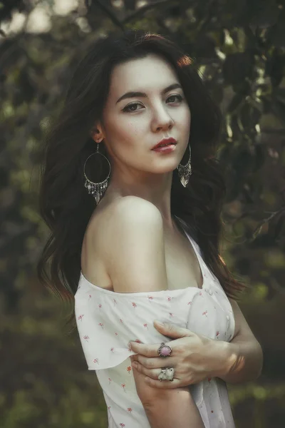 Beautiful young girl in the  garden — Stock Photo, Image