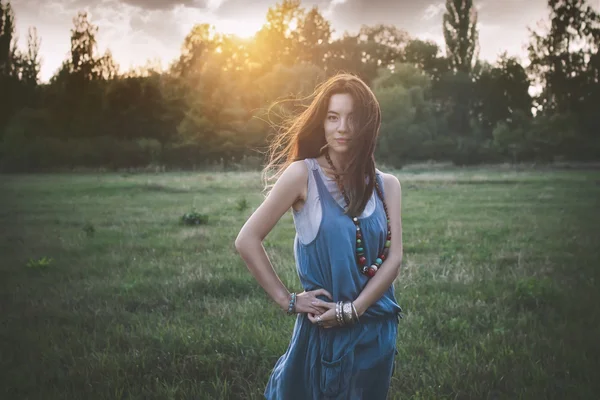 Portrait of the young beautiful  woman outdoors in the field — Stock Photo, Image