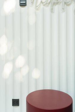 Empty red circular podium display on white wooden background with tree shadow red rectangle stand concept. Blank product shelf standing backdrop.