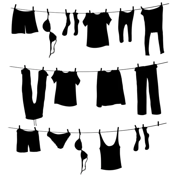 Siluetas de lavandería en una cuerda — Vector de stock