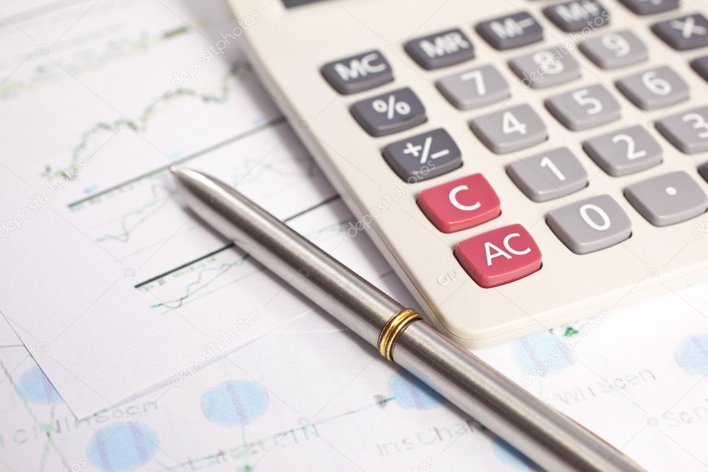 Financial charts and graphs on the table, Office working area