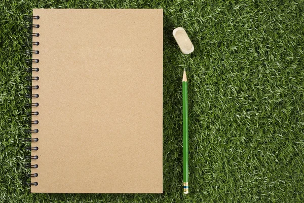 Notebook with pencil and rubber — Stock Photo, Image