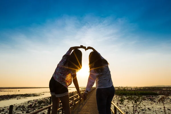 Girls showing love sign — Stock Photo, Image