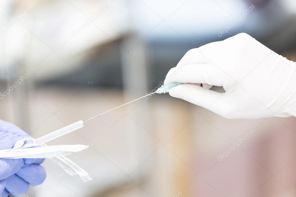 syringe in human hands